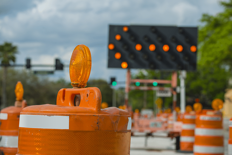 left arrow sign with traffic cones